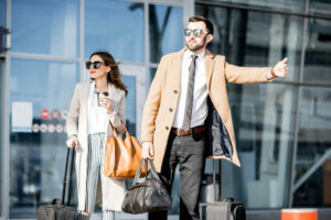 Business couple catching a taxi